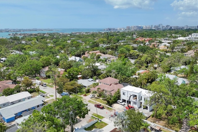 drone / aerial view featuring a water view and a view of city