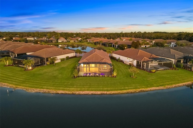 aerial view featuring a residential view and a water view