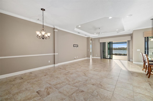 unfurnished room with baseboards, a raised ceiling, arched walkways, and crown molding