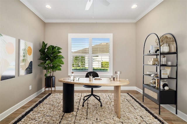 office area featuring wood finished floors, baseboards, and ornamental molding