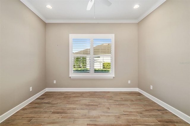 empty room featuring a ceiling fan, crown molding, wood finished floors, and baseboards