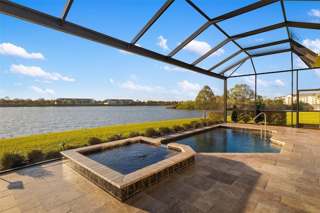 view of pool with a pool with connected hot tub, a water view, a lanai, a lawn, and a patio area