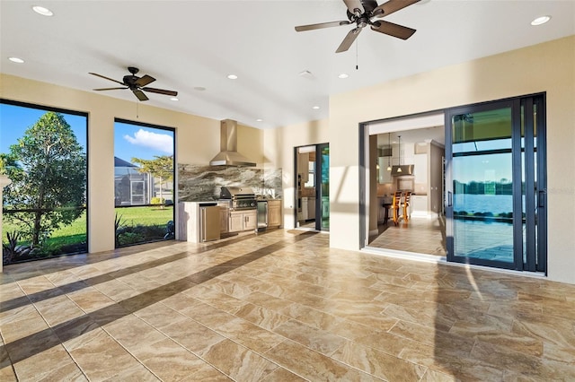 unfurnished living room with recessed lighting, marble finish floor, and ceiling fan