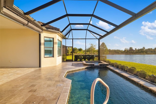 view of swimming pool featuring a water view, a pool with connected hot tub, a lanai, and a patio area