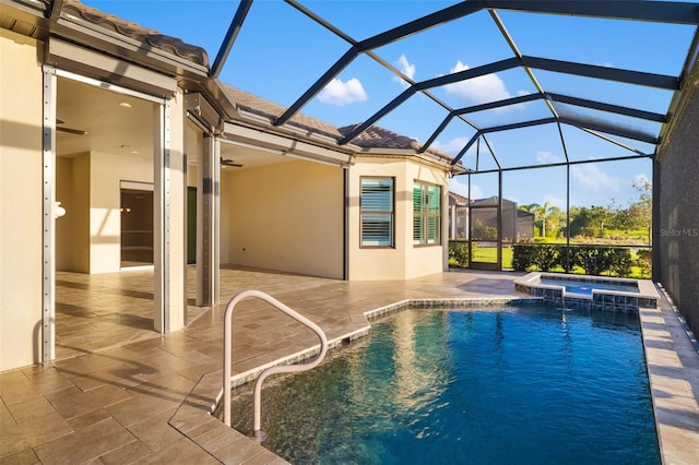 view of pool with a lanai, a patio area, a pool with connected hot tub, and ceiling fan