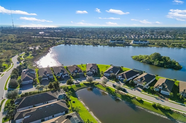 aerial view featuring a residential view and a water view