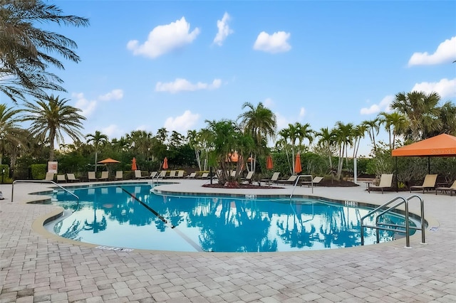 community pool with a patio area