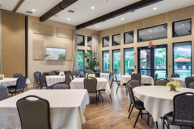 dining room with beam ceiling, recessed lighting, visible vents, and light wood-type flooring