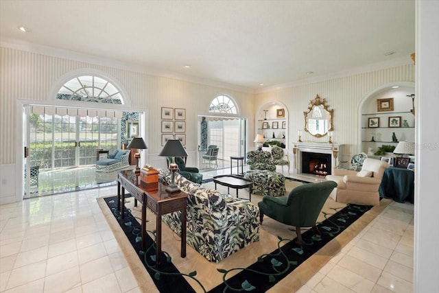 236 Saint James Park, Osprey, FL 34229 - living room with tile patterned floors, a lit fireplace, wallpapered walls, and built in shelves