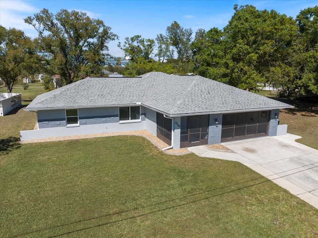 ranch-style house with a front yard, roof with shingles, driveway, and a sunroom