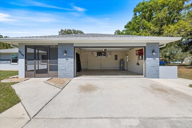 garage featuring concrete driveway