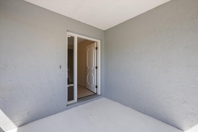 entrance to property featuring stucco siding