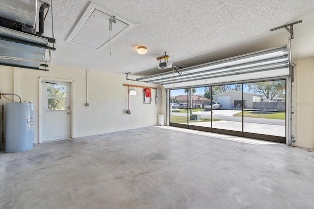 garage featuring a garage door opener and water heater