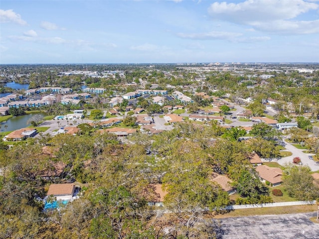 bird's eye view with a residential view and a water view