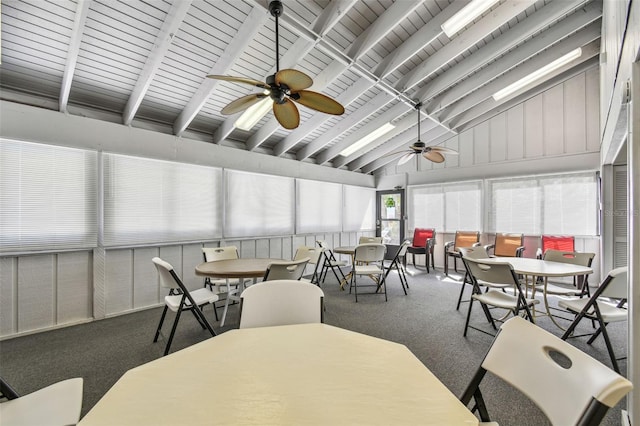 sunroom with a ceiling fan and vaulted ceiling