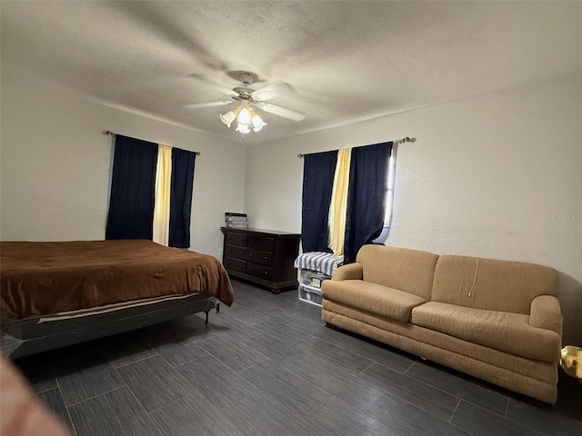 bedroom with a textured ceiling and ceiling fan