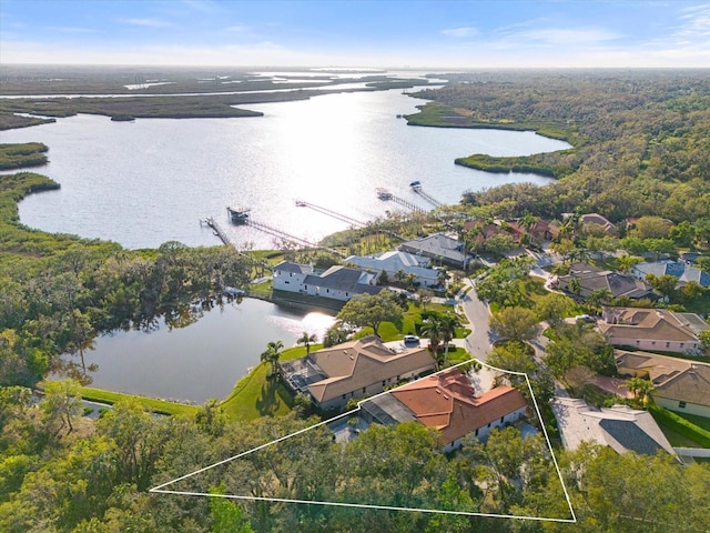 aerial view featuring a water view and a residential view