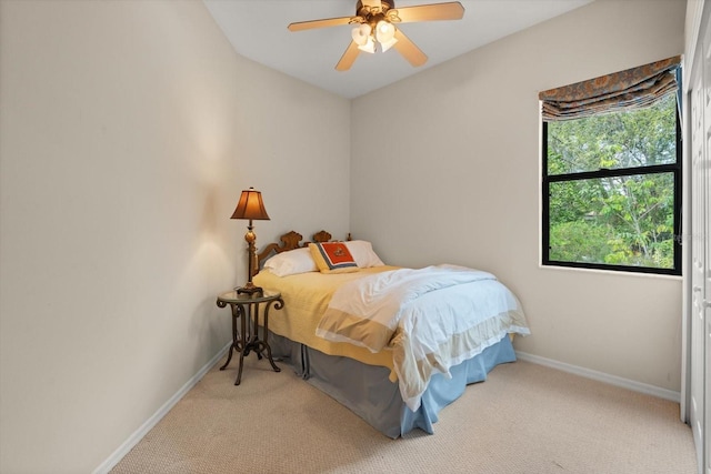 bedroom with baseboards, a ceiling fan, and carpet flooring