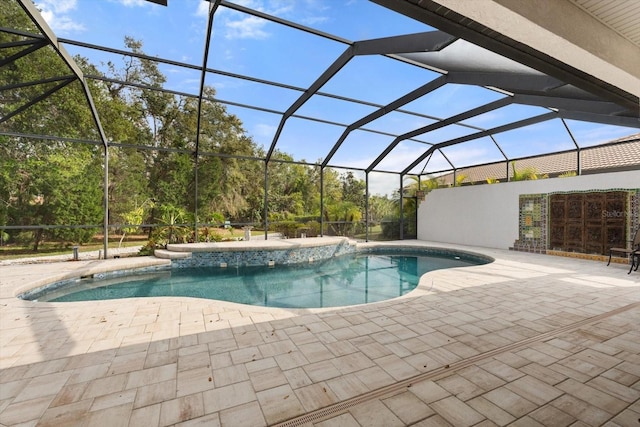 outdoor pool featuring a lanai and a patio