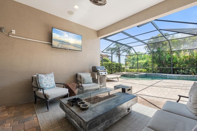 view of patio / terrace featuring a lanai, grilling area, a pool with connected hot tub, and a fire pit