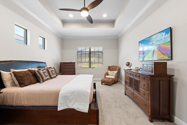 bedroom featuring baseboards, a tray ceiling, recessed lighting, ceiling fan, and light colored carpet