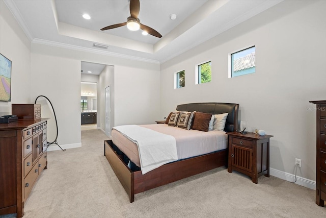 bedroom with visible vents, ornamental molding, baseboards, a raised ceiling, and light colored carpet