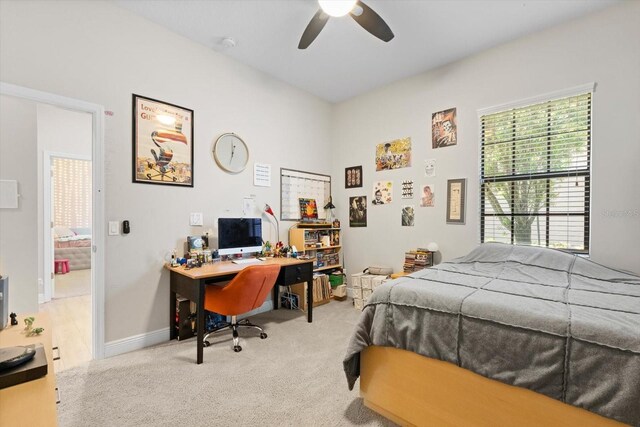 bedroom featuring a ceiling fan, carpet, and baseboards