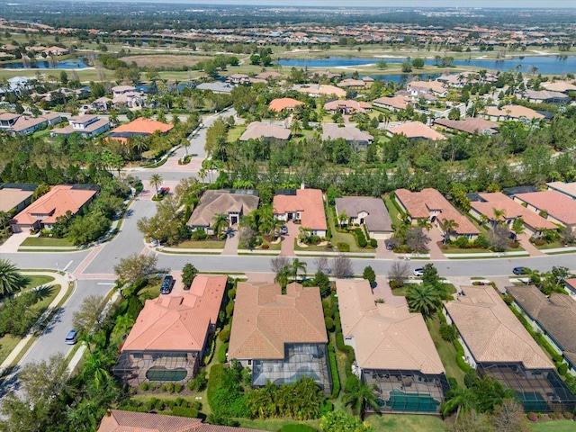 bird's eye view with a residential view and a water view