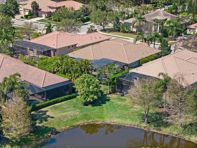 birds eye view of property with a residential view and a water view