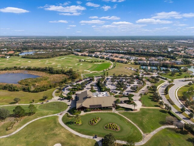 drone / aerial view featuring a water view and golf course view