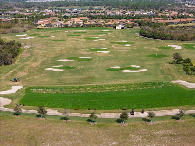 bird's eye view with view of golf course