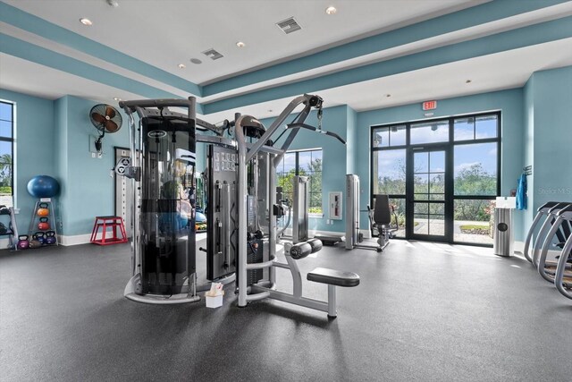 gym with recessed lighting, visible vents, baseboards, and french doors