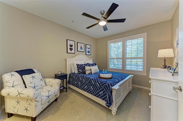 bedroom featuring a ceiling fan, carpet, and baseboards