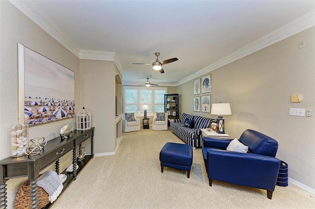 living area featuring carpet flooring, baseboards, ceiling fan, and ornamental molding