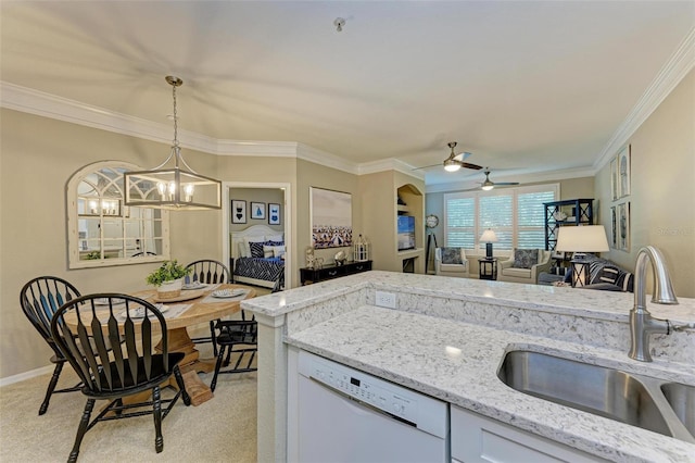 kitchen with pendant lighting, ornamental molding, ceiling fan with notable chandelier, a sink, and dishwasher