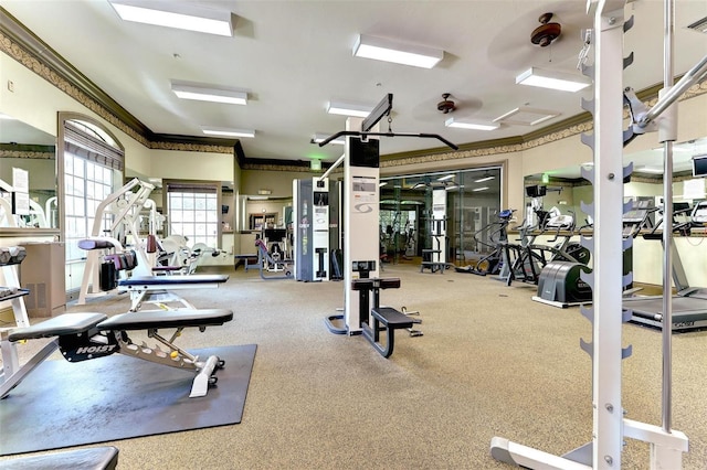 gym featuring crown molding