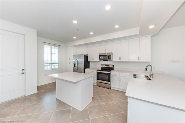 kitchen with light tile patterned flooring, recessed lighting, a sink, stainless steel appliances, and a center island