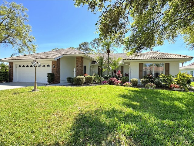 5906 Garden Lakes Majestic, Bradenton, FL 34203 - single story home with stucco siding, driveway, a front yard, an attached garage, and a tiled roof