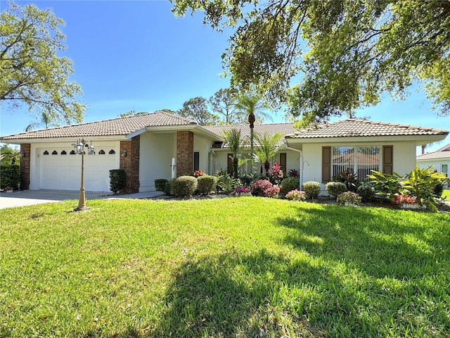 single story home with stucco siding, driveway, a front yard, an attached garage, and a tiled roof