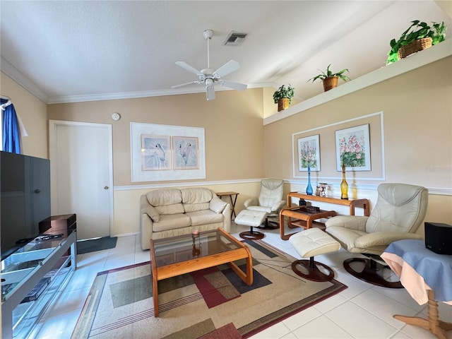 living area with visible vents, lofted ceiling, ornamental molding, tile patterned flooring, and ceiling fan