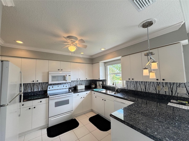 kitchen with visible vents, pendant lighting, a sink, white appliances, and crown molding