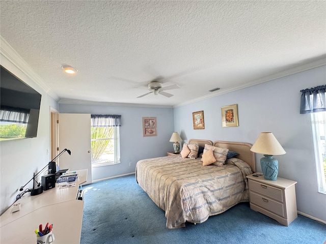 carpeted bedroom featuring crown molding, a ceiling fan, baseboards, and a textured ceiling