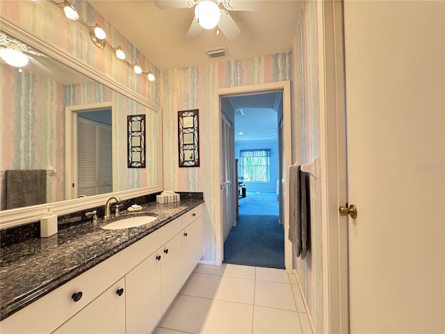 bathroom with visible vents, a ceiling fan, wallpapered walls, tile patterned flooring, and vanity