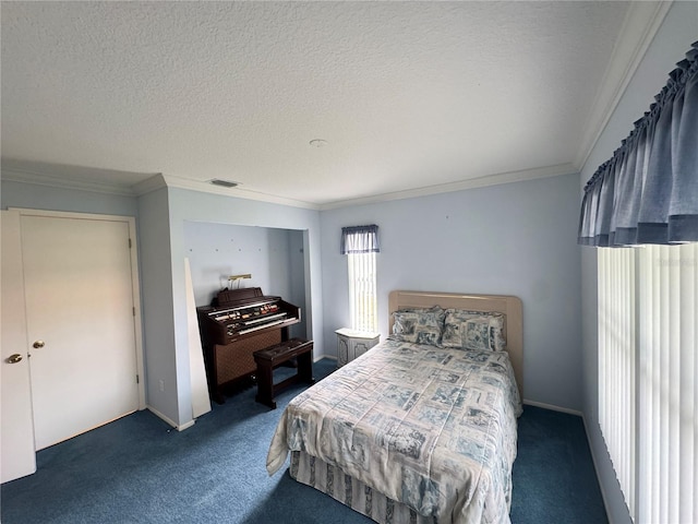 carpeted bedroom with visible vents, a textured ceiling, and ornamental molding