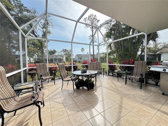 view of patio / terrace featuring a lanai