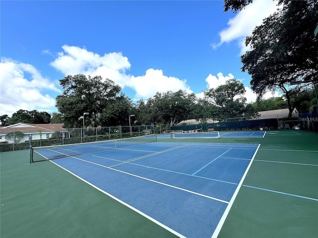 view of sport court with fence