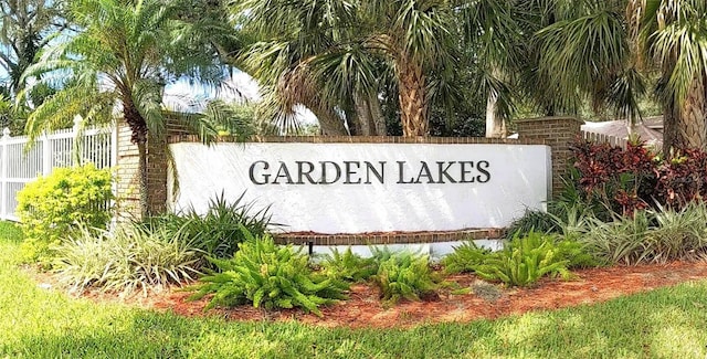 community sign with fence