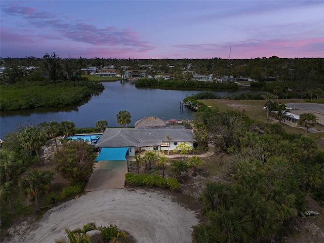 aerial view at dusk with a water view