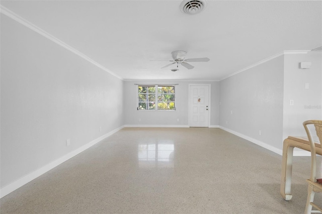 empty room featuring baseboards, visible vents, light speckled floor, and a ceiling fan