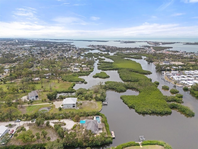 birds eye view of property featuring a water view